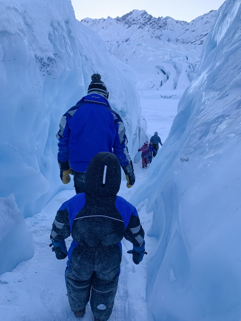 People walking on glacier